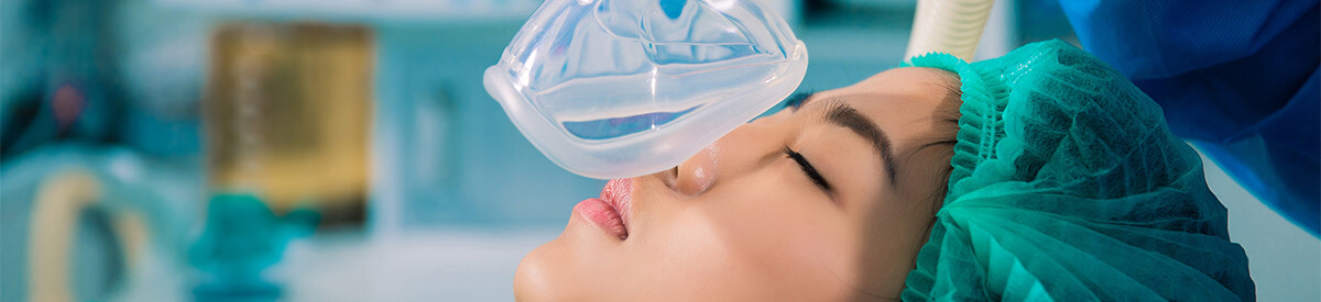 Photo of oxygen mask being placed on patient